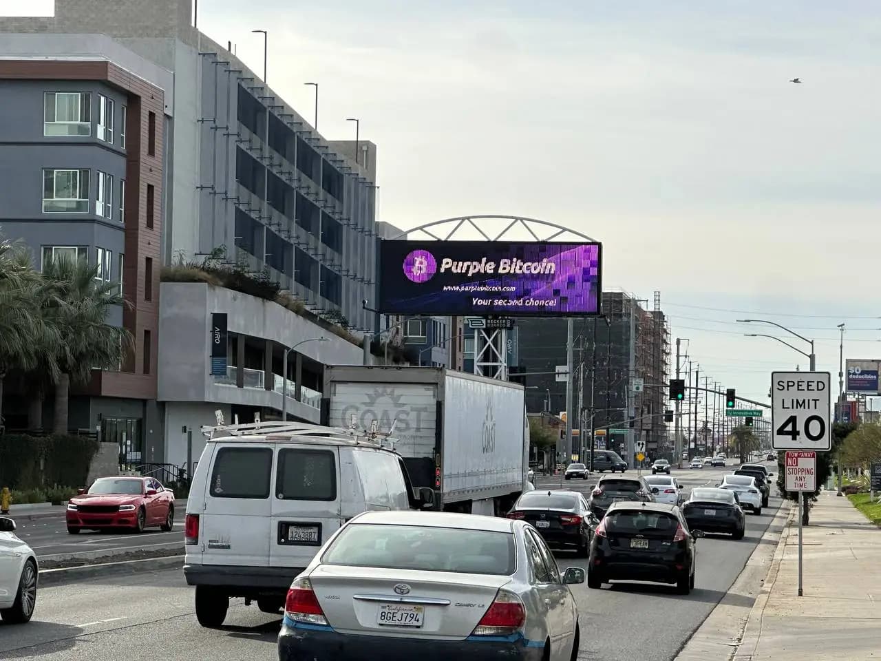 Purple Bitcoin billboard marketing activation