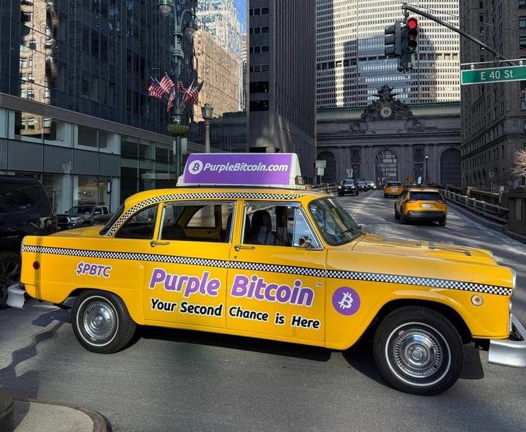 Purple Bitcoin branded taxi at a New York City crosswalk