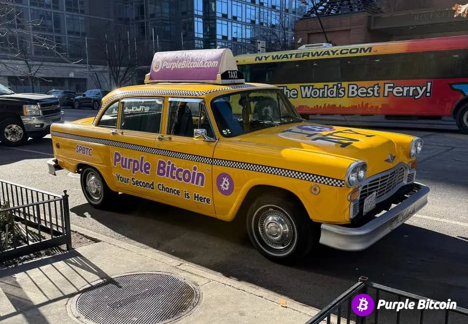 Purple Bitcoin branded Checker Cab-style taxi wrap in New York City