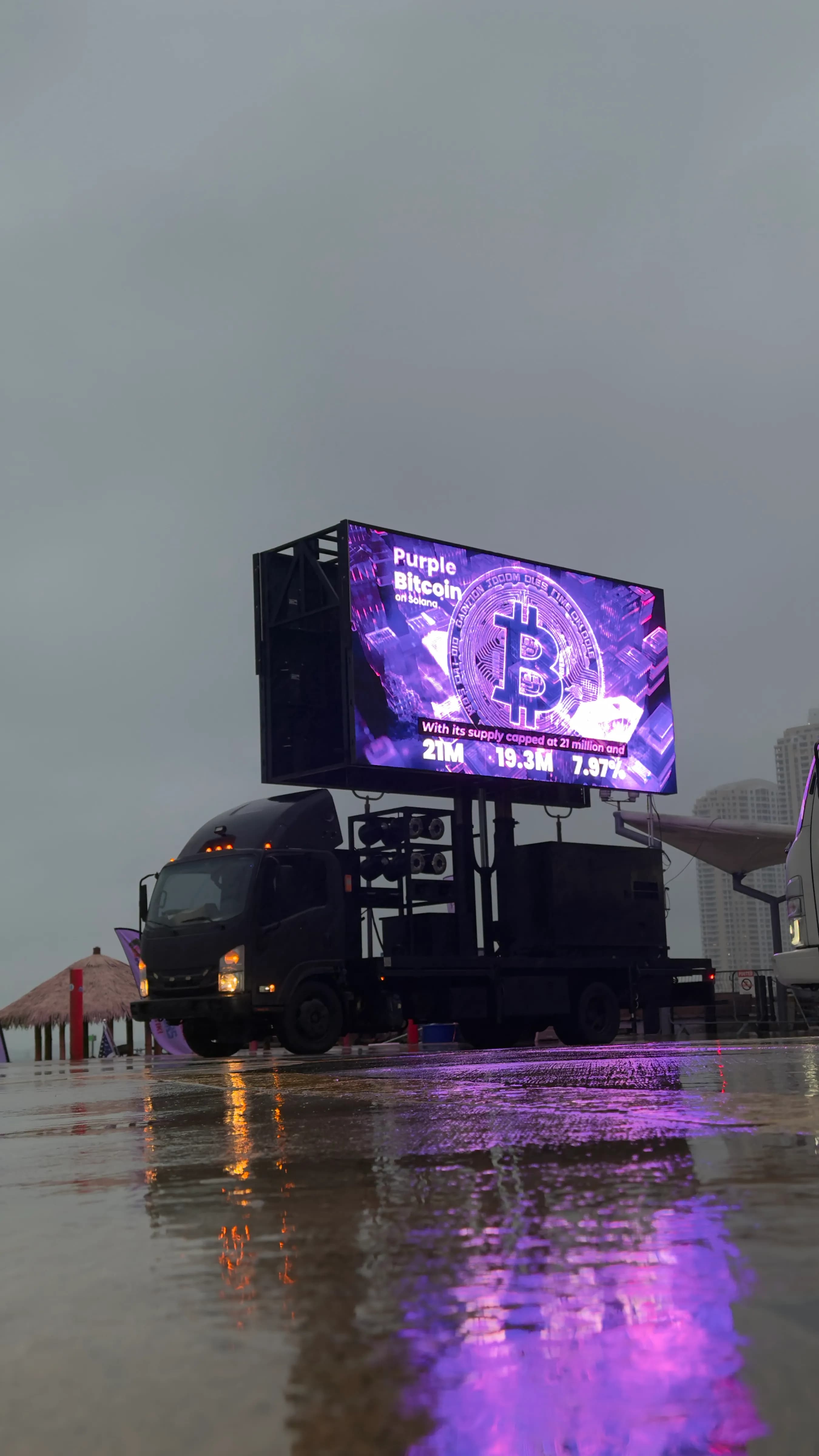 Purple Bitcoin promotional truck outside the WAGMI Festival in Miami