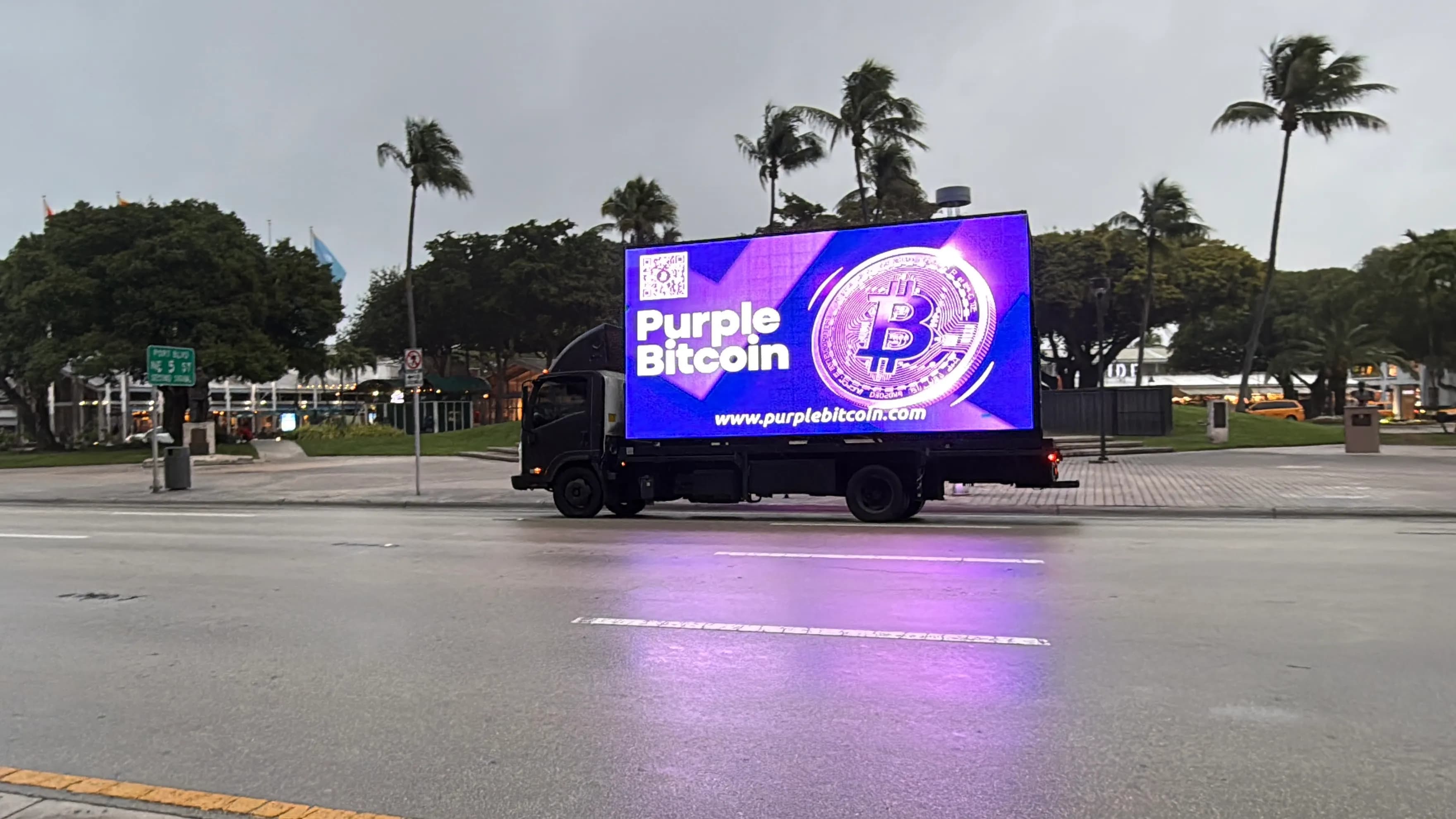 Purple Bitcoin truck at WAGMI Festival Miami